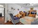 Comfortable living room with plush recliner, wooden desk, and entertainment center, creating a cozy space at 3323 Maclyon Way, Las Vegas, NV 89121