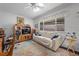 Comfortable living room with a plush sofa, soft lighting, and view to the backyard at 3323 Maclyon Way, Las Vegas, NV 89121