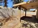 Spacious backyard featuring a covered patio and block wall fencing for privacy at 3619 Edinburgh Dr, Las Vegas, NV 89103