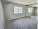 Comfortable bedroom with neutral walls, plush carpeting, and a large window at 3619 Edinburgh Dr, Las Vegas, NV 89103