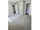 A bedroom with neutral walls, plush carpeting, and sliding mirror closet doors at 3619 Edinburgh Dr, Las Vegas, NV 89103