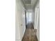 A hallway with wood-look flooring and white walls leads to various rooms at 3619 Edinburgh Dr, Las Vegas, NV 89103