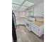 Bright kitchen featuring white appliances, cabinets and wood floors at 3619 Edinburgh Dr, Las Vegas, NV 89103