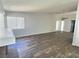 Large, open living room features wood floors, a ceiling fan and lots of natural light at 3619 Edinburgh Dr, Las Vegas, NV 89103
