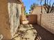 Side yard with desert landscaping and block walls at 3619 Edinburgh Dr, Las Vegas, NV 89103