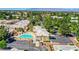 Wonderful aerial view of a community pool and clubhouse surrounded by lush trees at 364 Wild Plum Ln, Las Vegas, NV 89107
