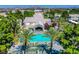 Stunning aerial view of the community pool surrounded by palm trees and lush landscaping at 364 Wild Plum Ln, Las Vegas, NV 89107