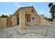 Stucco home featuring a covered patio, gravel landscaping, and a private backyard at 364 Wild Plum Ln, Las Vegas, NV 89107