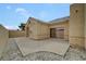 Home featuring a covered patio, gravel landscaping, and private block wall at 364 Wild Plum Ln, Las Vegas, NV 89107