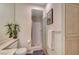 A toilet and shower with light wood cabinets, gold hardware, and a plant at 364 Wild Plum Ln, Las Vegas, NV 89107