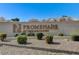 Elegant community sign surrounded by meticulously maintained landscaping and gravel at 364 Wild Plum Ln, Las Vegas, NV 89107