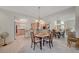 Bright dining area featuring tile floors and an open layout to the updated kitchen at 364 Wild Plum Ln, Las Vegas, NV 89107
