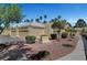 Charming single-story home with a two-car garage, desert landscaping, and a tiled roof at 364 Wild Plum Ln, Las Vegas, NV 89107