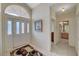 Bright foyer features tile flooring, a large window above front door, and neutral walls at 364 Wild Plum Ln, Las Vegas, NV 89107