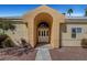 Inviting front entrance featuring a prominent archway with half-round window at 364 Wild Plum Ln, Las Vegas, NV 89107