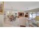 Open-concept living room featuring dining area, bar seating, and natural light at 364 Wild Plum Ln, Las Vegas, NV 89107
