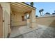 This covered patio features stucco walls and neutral gravel providing a serene outdoor setting at 364 Wild Plum Ln, Las Vegas, NV 89107