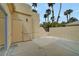 Exterior view of a home with a stucco exterior, block wall fence, and low-maintenance landscaping at 364 Wild Plum Ln, Las Vegas, NV 89107