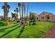 Well-manicured lawn and desert landscaping create an inviting outdoor space at 364 Wild Plum Ln, Las Vegas, NV 89107