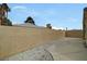 Property featuring a block wall fence, stucco exterior, and low-maintenance desert landscaping at 364 Wild Plum Ln, Las Vegas, NV 89107