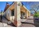Covered patio with stone supports overlooks the desert landscaping at 3663 Coventry Gardens Dr, Las Vegas, NV 89135