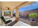 This covered patio with ceiling fan provides nice views of the backyard at 3663 Coventry Gardens Dr, Las Vegas, NV 89135