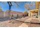Backyard featuring desert landscaping, stone pathway, and covered patio at 3663 Coventry Gardens Dr, Las Vegas, NV 89135
