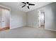 Neutral bedroom with adjacent bathroom and bedrooms featuring plush carpeting at 3663 Coventry Gardens Dr, Las Vegas, NV 89135