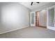 Bedroom featuring neutral carpet and shutter doors leading to additional rooms at 3663 Coventry Gardens Dr, Las Vegas, NV 89135