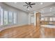 Corner view of light filled bedroom with plantation shutters and wood-look flooring at 3663 Coventry Gardens Dr, Las Vegas, NV 89135