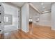 Open hallway view showcases seamless transition to a bright bedroom and living area at 3663 Coventry Gardens Dr, Las Vegas, NV 89135