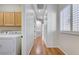 Hallway with wood floors and lots of natural light from the window at 3663 Coventry Gardens Dr, Las Vegas, NV 89135