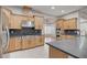 Modern kitchen featuring stainless steel appliances, gas range, and breakfast bar at 3663 Coventry Gardens Dr, Las Vegas, NV 89135