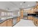 Gourmet kitchen boasts stainless steel appliances, large island, and ample storage at 3663 Coventry Gardens Dr, Las Vegas, NV 89135