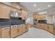 Well-equipped kitchen with stainless steel appliances, gas range, and maple cabinetry at 3663 Coventry Gardens Dr, Las Vegas, NV 89135