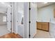 Bright laundry room with a washer, dryer, sink and wooden cabinets at 3663 Coventry Gardens Dr, Las Vegas, NV 89135