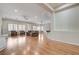 Spacious living room with hardwood floors, natural light, fireplace, comfortable seating, and ceiling fans at 3663 Coventry Gardens Dr, Las Vegas, NV 89135