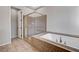 Elegant bathroom showcasing a glass-enclosed shower and luxurious soaking tub at 3663 Coventry Gardens Dr, Las Vegas, NV 89135