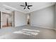 Generously sized main bedroom offers a tranquil space with plush carpet and contemporary ceiling fan at 3663 Coventry Gardens Dr, Las Vegas, NV 89135