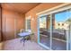 Enclosed balcony with tile flooring, small table and chairs, and beautiful views at 3920 Legend Hills St # 202, Las Vegas, NV 89129