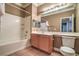 Well-lit bathroom features a shower-tub combo, a light wood vanity, and a modern toilet at 3920 Legend Hills St # 202, Las Vegas, NV 89129