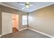 Bedroom featuring a ceiling fan, neutral carpet, and a closet at 3920 Legend Hills St # 202, Las Vegas, NV 89129