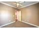 Bedroom with neutral carpeting and paint, featuring a walk-in closet at 3920 Legend Hills St # 202, Las Vegas, NV 89129