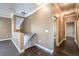 Hallway featuring wood floors and a view of the staircase at 3920 Legend Hills St # 202, Las Vegas, NV 89129