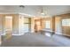 Inviting living room with open floor plan, modern lighting, and large windows at 3920 Legend Hills St # 202, Las Vegas, NV 89129