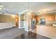 Open-concept living room with stainless steel appliances and breakfast bar at 3920 Legend Hills St # 202, Las Vegas, NV 89129