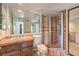 Bathroom offering a large vanity with a tiled shower and a seamless glass door at 4043 Chalfont Ct, Las Vegas, NV 89121