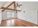 Bright bedroom with hardwood floors, ceiling fan, and exposed beams at 4043 Chalfont Ct, Las Vegas, NV 89121