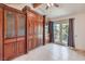 Bedroom features built-in cabinetry, a Murphy bed, and doors that lead to the outside at 4043 Chalfont Ct, Las Vegas, NV 89121