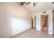 Bedroom includes a vaulted ceiling, wood-look flooring, and access to the en-suite bathroom at 4043 Chalfont Ct, Las Vegas, NV 89121